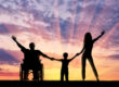 Family Holding hands enjoying the sunset. Member Benefits Header Image